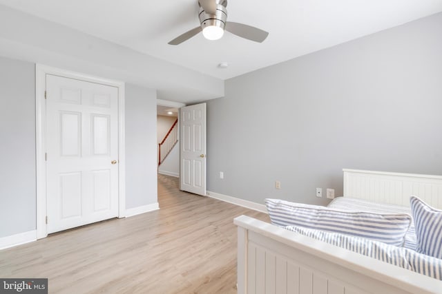 bedroom with ceiling fan and light hardwood / wood-style flooring