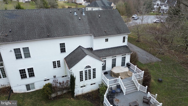 rear view of house featuring a deck