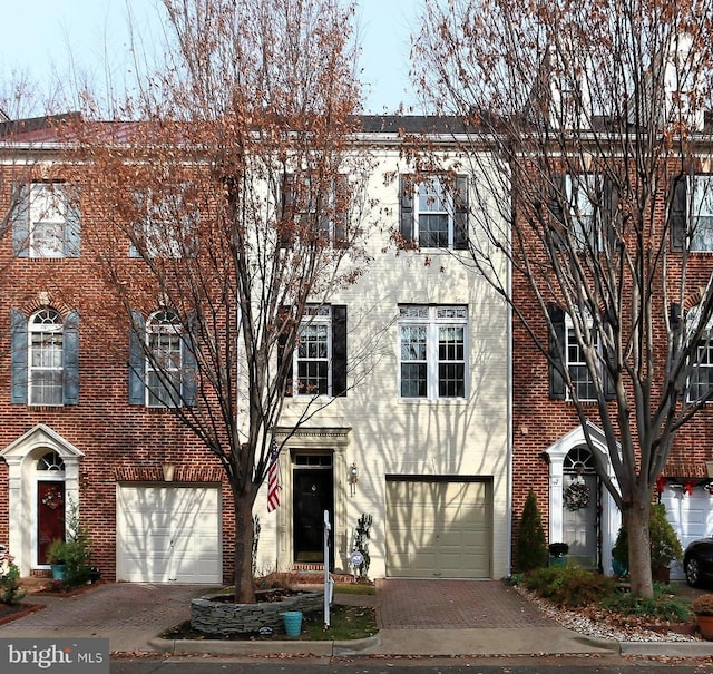 multi unit property featuring a garage