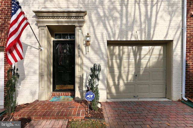 doorway to property featuring a garage