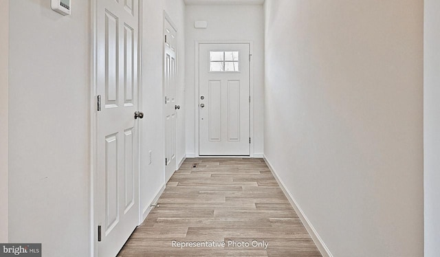 doorway featuring light hardwood / wood-style floors