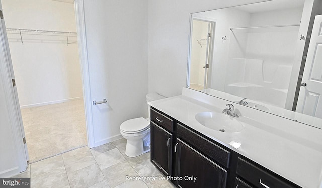 bathroom with a shower, vanity, and toilet