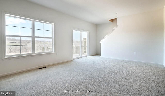 empty room with carpet flooring