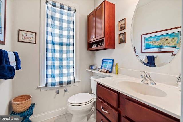 bathroom with tile patterned floors, vanity, and toilet