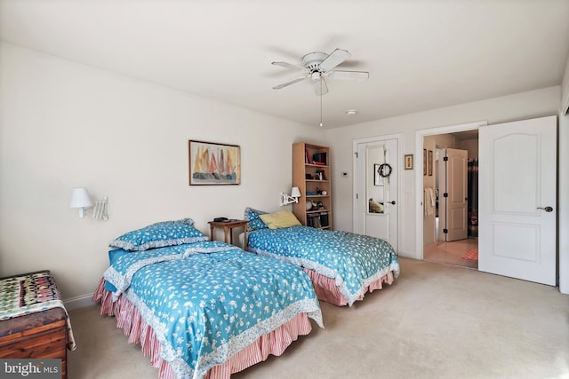 bedroom featuring ceiling fan and carpet