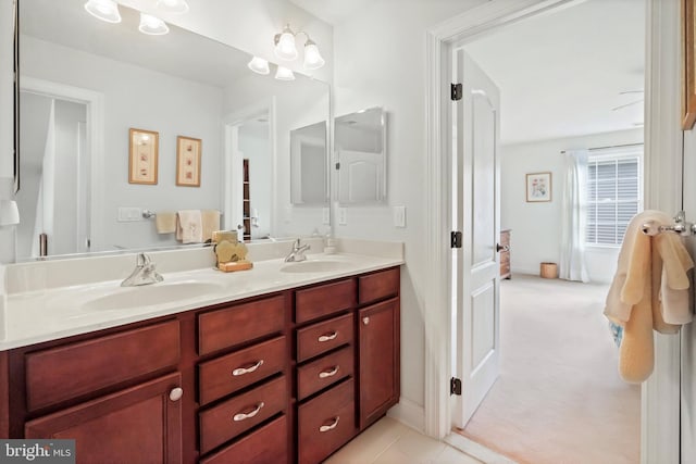 bathroom featuring tile patterned flooring and vanity