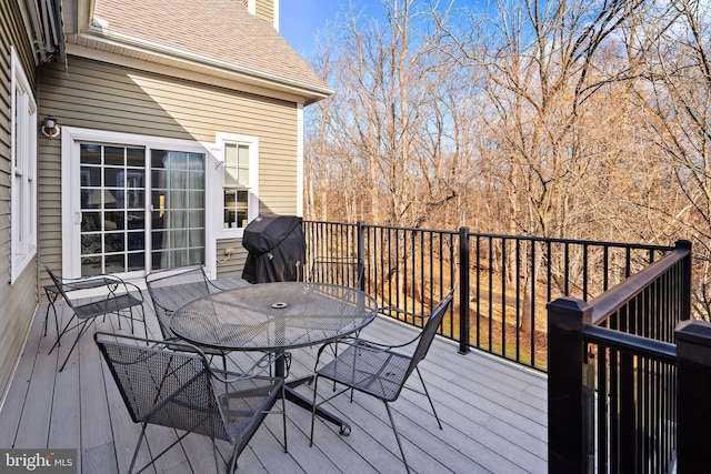 wooden deck with a grill