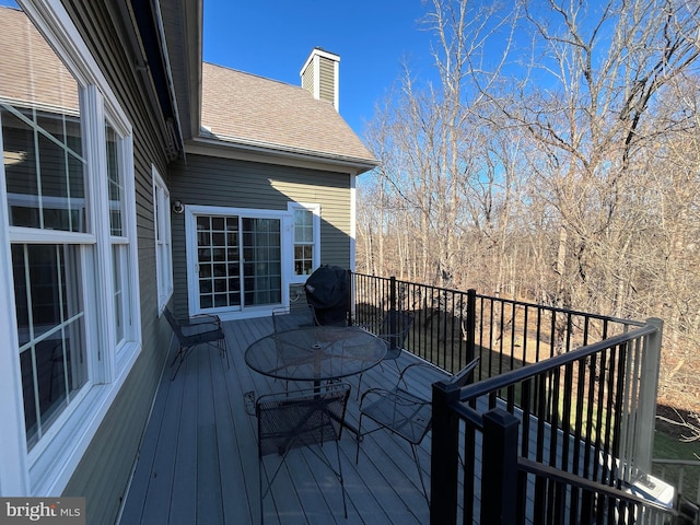 wooden deck featuring area for grilling