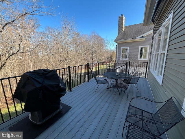 wooden terrace with area for grilling