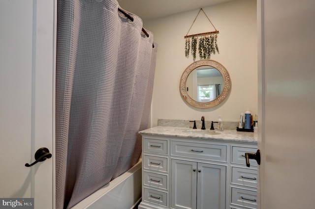 bathroom featuring vanity and shower / tub combo