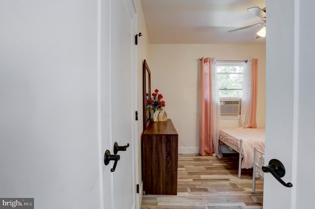 interior space featuring cooling unit and light hardwood / wood-style flooring