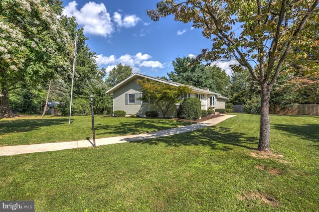 view of home's exterior featuring a lawn