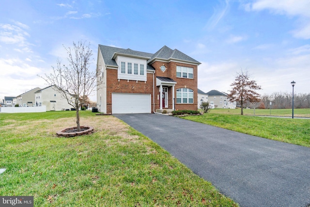 view of front of property with a garage and a front lawn