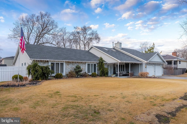 single story home featuring a front yard and a garage