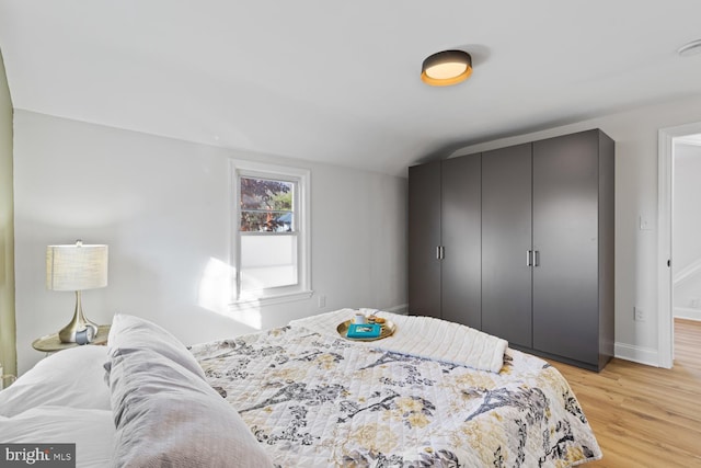 bedroom with light hardwood / wood-style floors