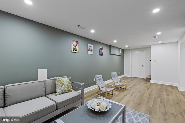 living room with light hardwood / wood-style flooring