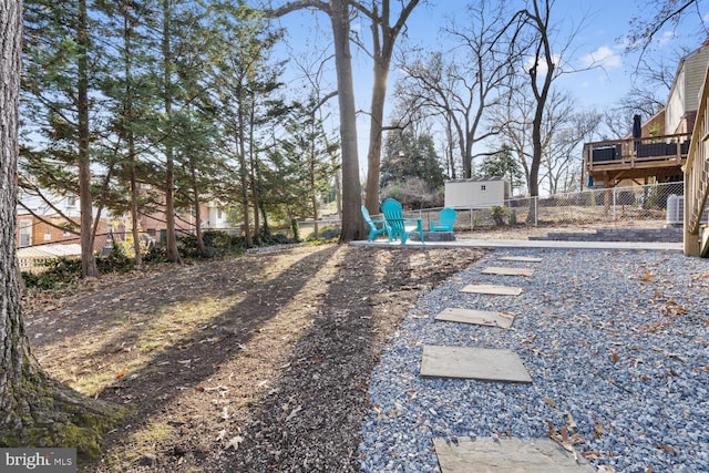 view of yard featuring a wooden deck