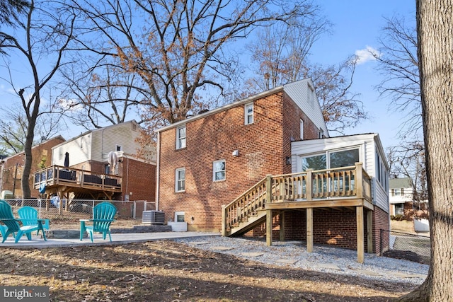 rear view of property with a deck