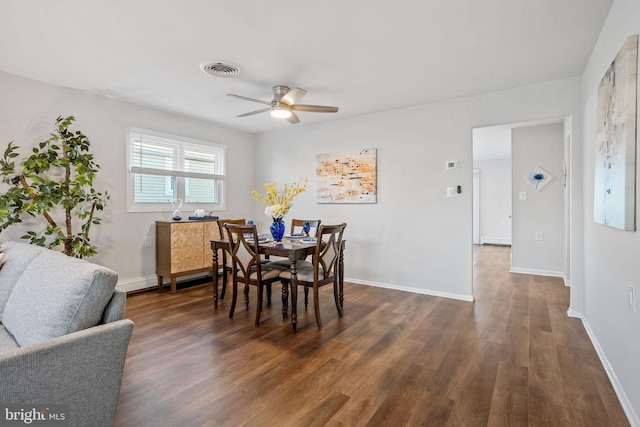 dining area with dark hardwood / wood-style floors and ceiling fan