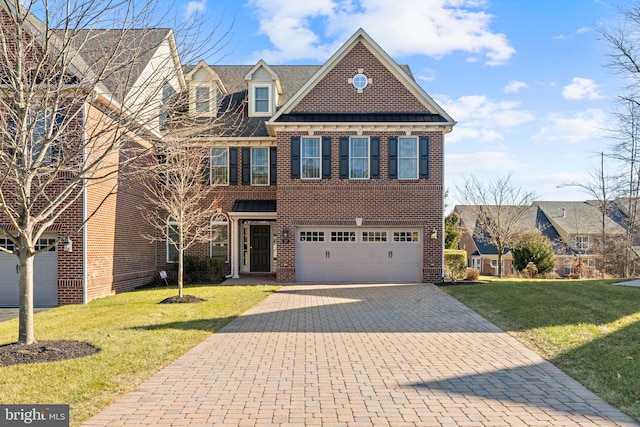 view of front of house featuring a front yard and a garage