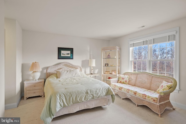 bedroom featuring light colored carpet