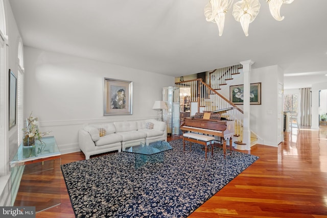 living room featuring hardwood / wood-style floors and an inviting chandelier