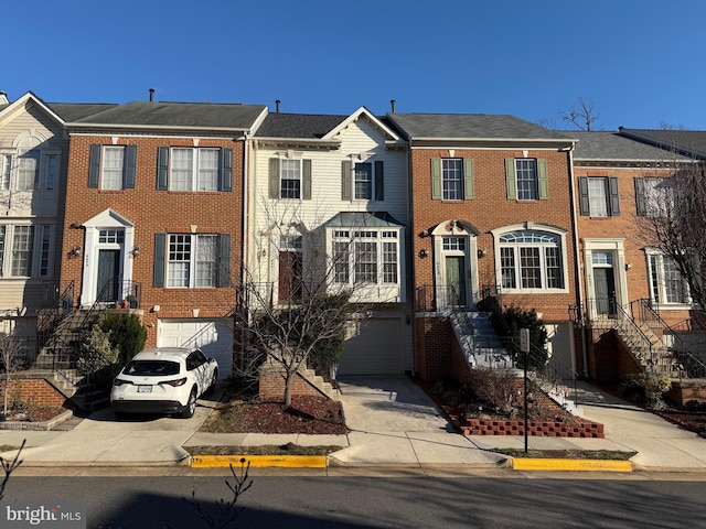 townhome / multi-family property featuring a garage