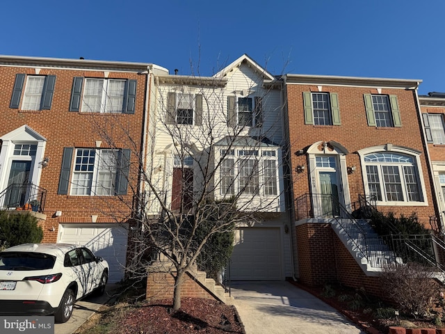 townhome / multi-family property featuring a garage