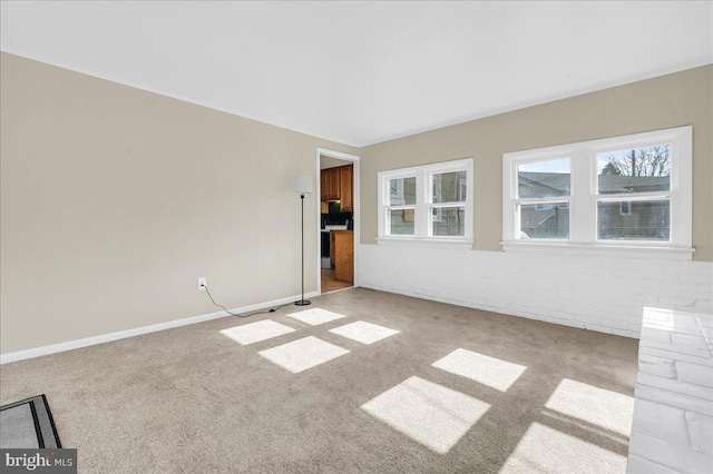 unfurnished room featuring light carpet