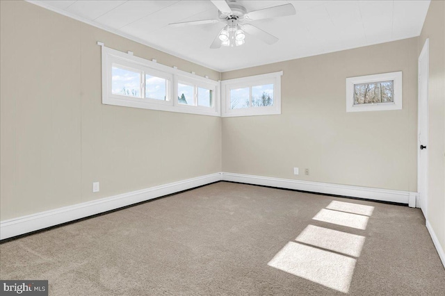 spare room with baseboard heating, ceiling fan, and carpet flooring