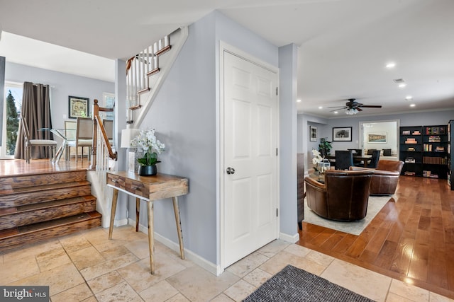 interior space with ceiling fan and light wood-type flooring