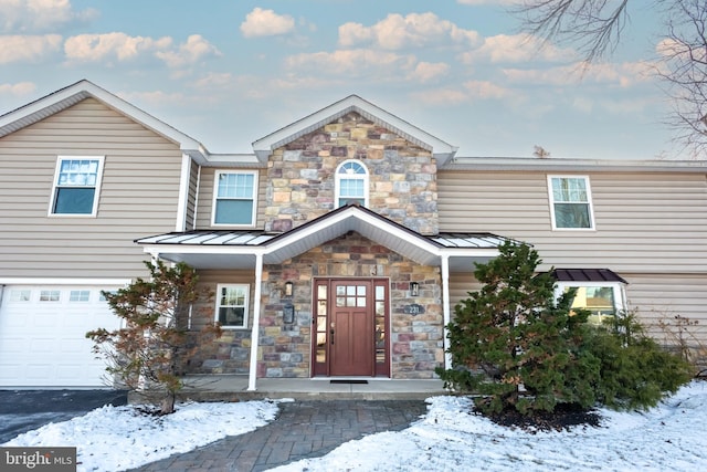 view of front of property with a garage