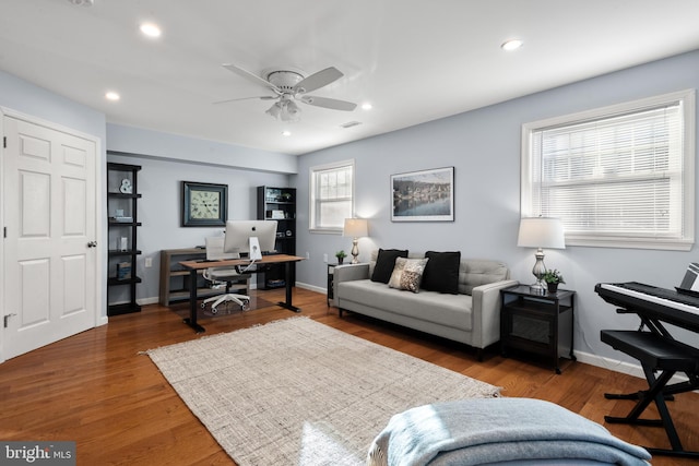 office with ceiling fan and dark hardwood / wood-style floors