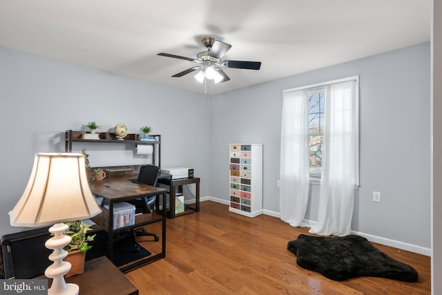 office area with ceiling fan and hardwood / wood-style flooring