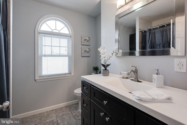 bathroom with toilet and vanity