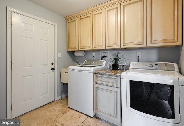 laundry room with cabinets and independent washer and dryer