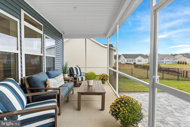 sunroom / solarium featuring plenty of natural light