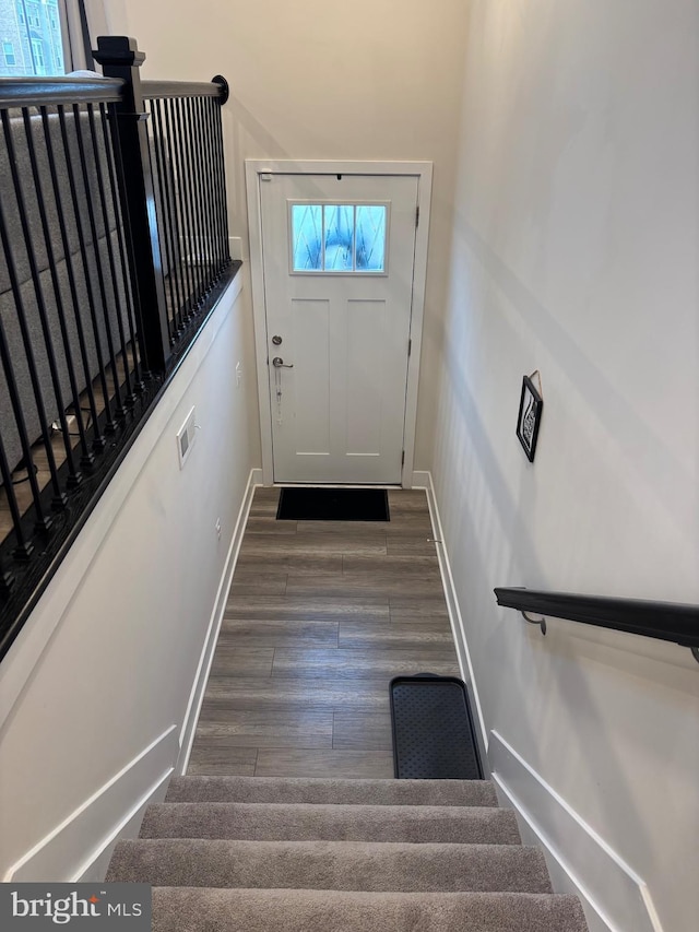 entryway with dark wood-type flooring