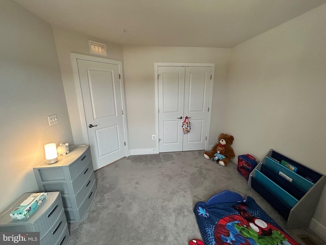 recreation room featuring light colored carpet