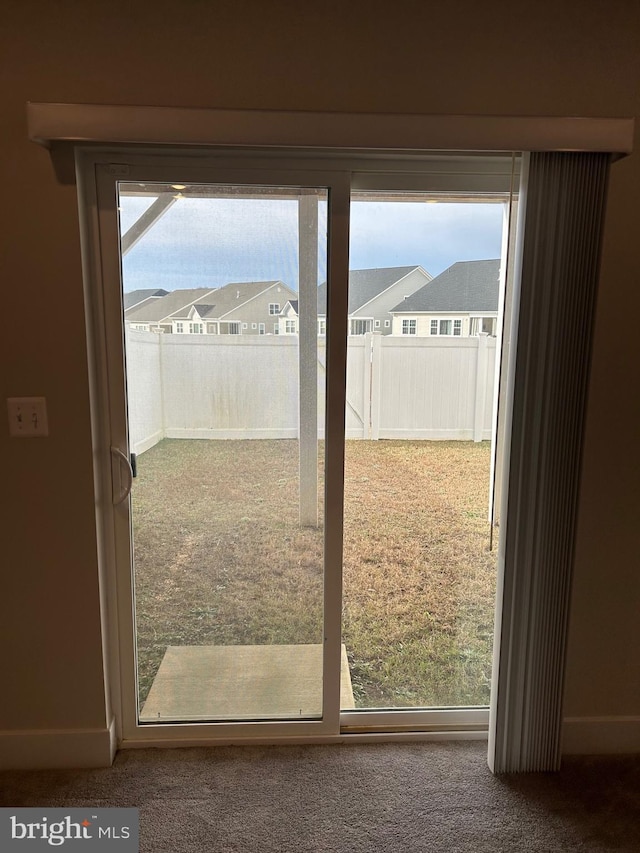 entryway featuring carpet flooring and plenty of natural light