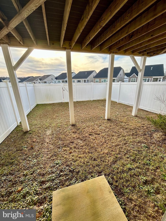 view of yard at dusk