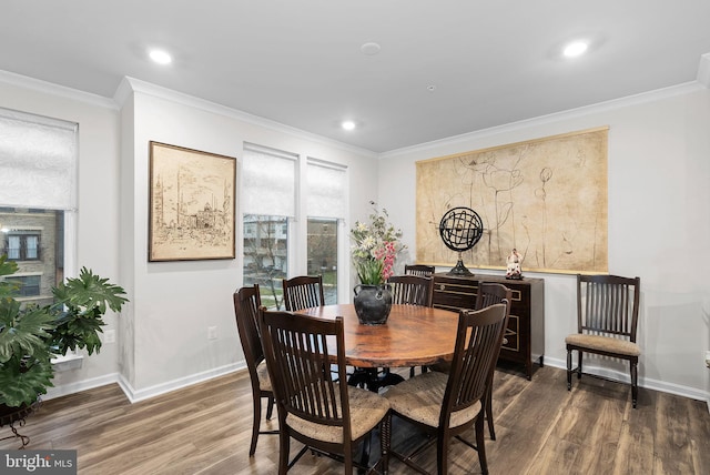 dining space with crown molding and dark wood-type flooring