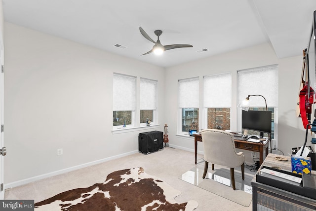 office with ceiling fan and light colored carpet