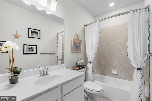 full bathroom with vanity, toilet, and shower / bathtub combination with curtain