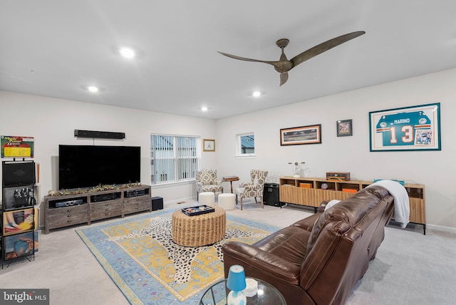 living room featuring light carpet and ceiling fan