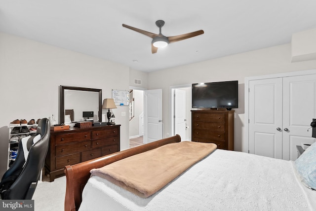 bedroom featuring ceiling fan and a closet