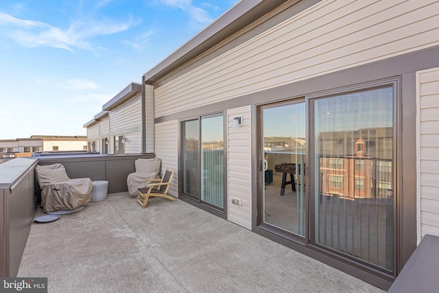 view of patio featuring a balcony