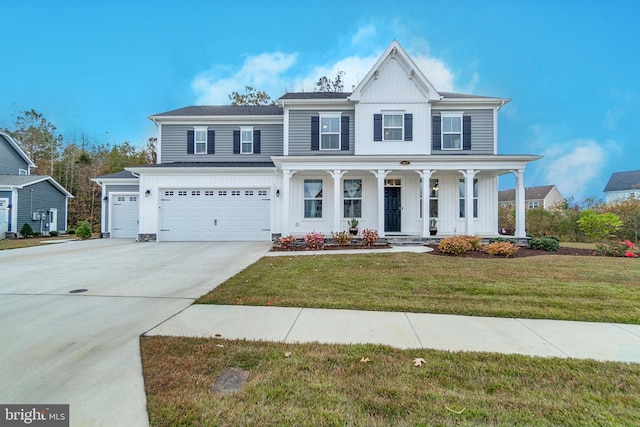 view of front of property with a front yard, a porch, and a garage