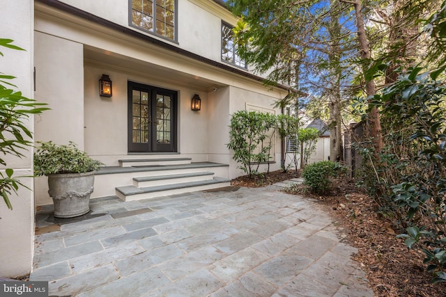 entrance to property with a patio