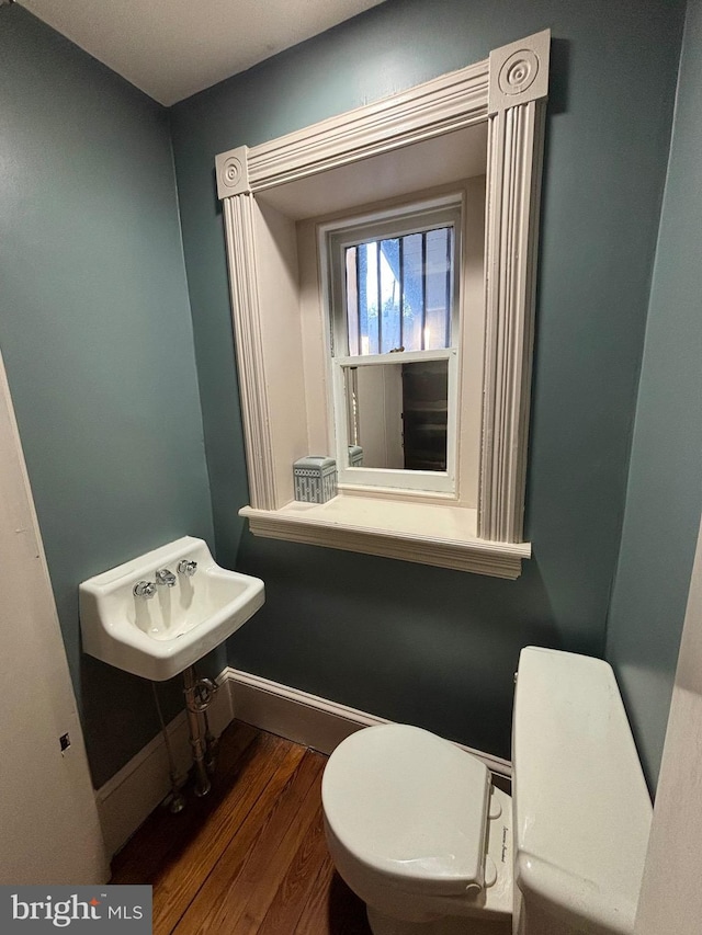 1250 Ashbourne Rd, Elkins Park, PA 19027 - half bathroom with toilet and wood finished floors